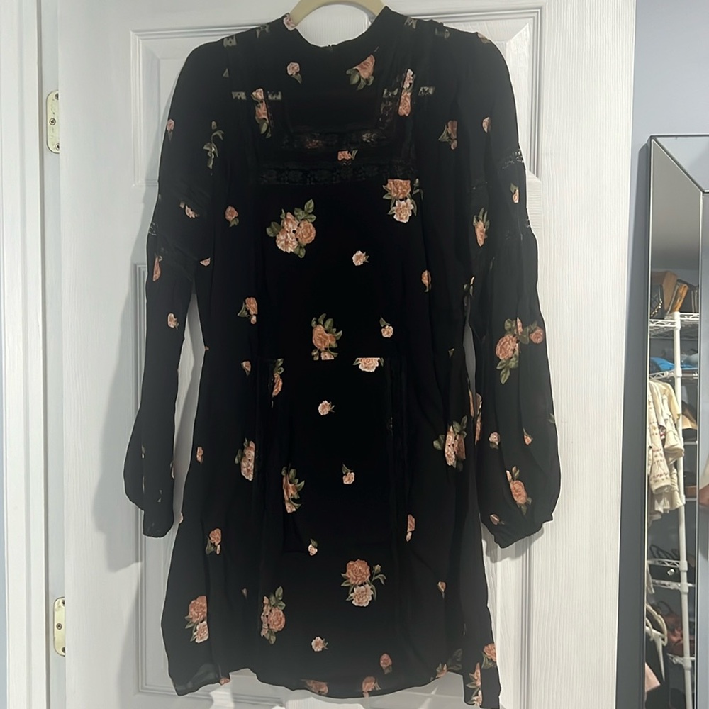 Reformation mini dress with rose floral print, lace detail on front and sleeves.